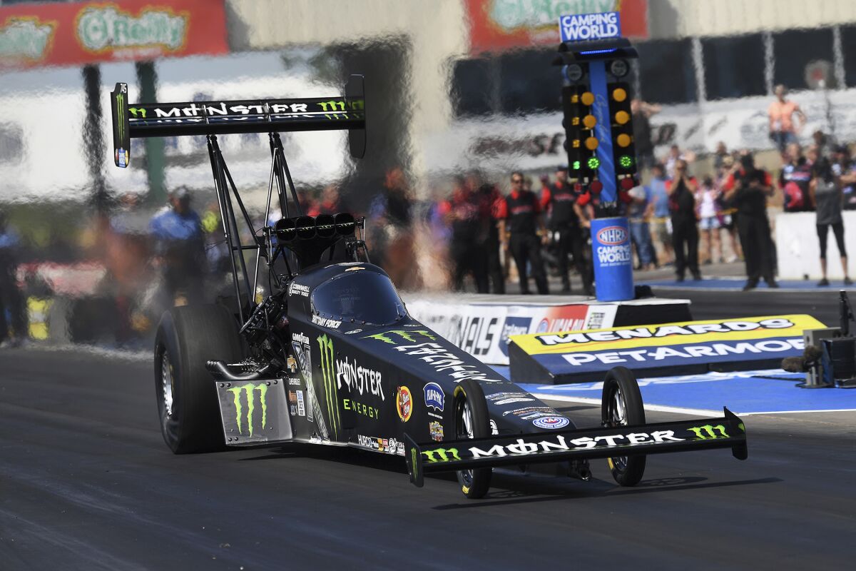 In this photo provided by the NHRA, Brittany Force drives on the way to the No. 1 spot in Top Fuel qualifying at the Menards NHRA Nationals drag races Saturday, Aug. 14, 2021, at Heartland Motorsports Park in Topeka, Kan. (Auto Imagery/NHRA via AP)