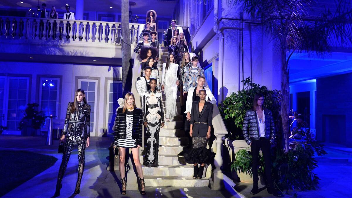 Models walk the outdoors runway at the Balmain celebration party for the opening of the brand's first Los Angeles boutique and its Beats by Dre collaboration on July 20 in Beverly Hills. (Stefanie Keenan / Getty Images for Balmain)