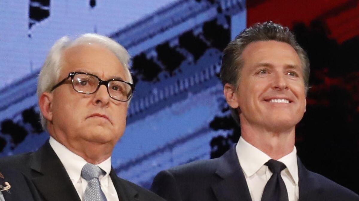 The gubernatorial candidates John Cox, left, and Lieutenant Governor Gavin Newsom, right, stand together before a debate inside Royce Hall at UCLA on January 25, 2018.