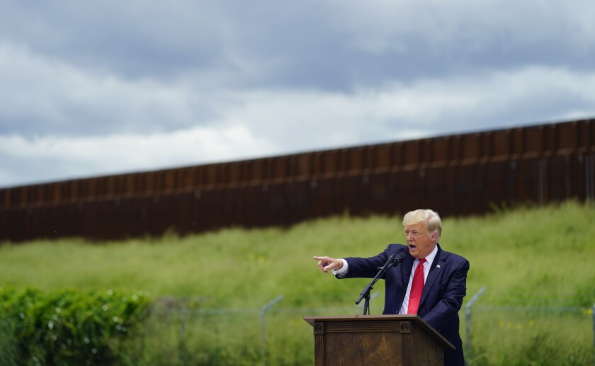 Former President Trump speaks in front of an unfinished section of border wall in Texas
