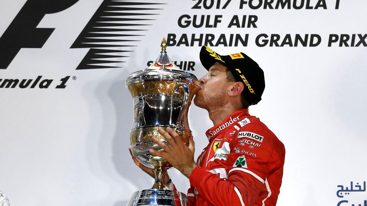 Sebastian Vettel celebrates on the podium after winning the Bahrain Grand Prix on Sunday.