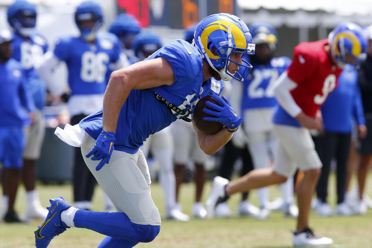 Wide receiver Cooper Kupp carries the ball during the first open practice of Los Angeles Rams training camp Friday.