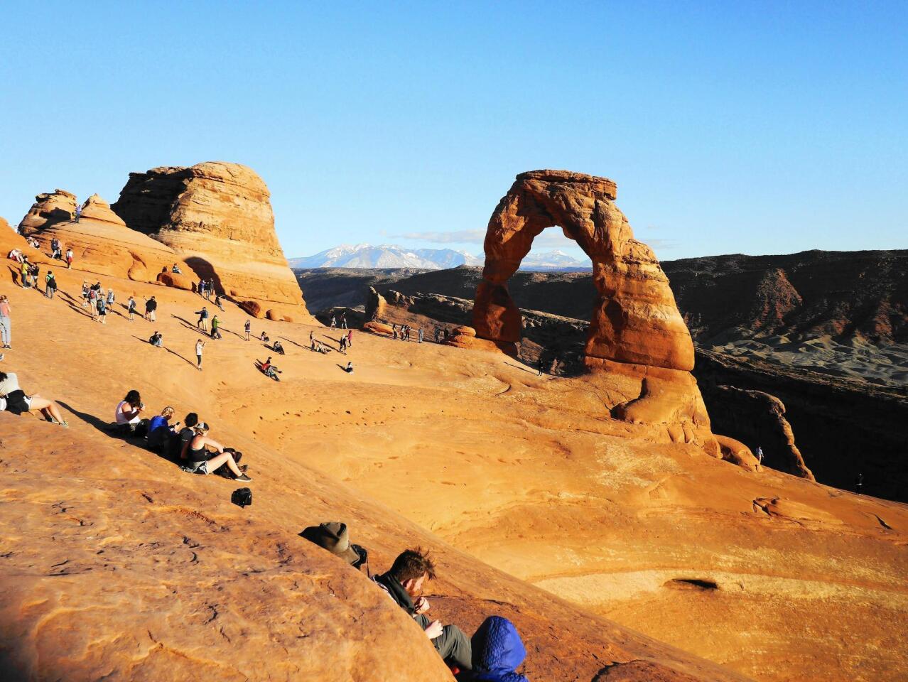 Delicate Arch in Arches National Park is a popular place to watch the sun go down.