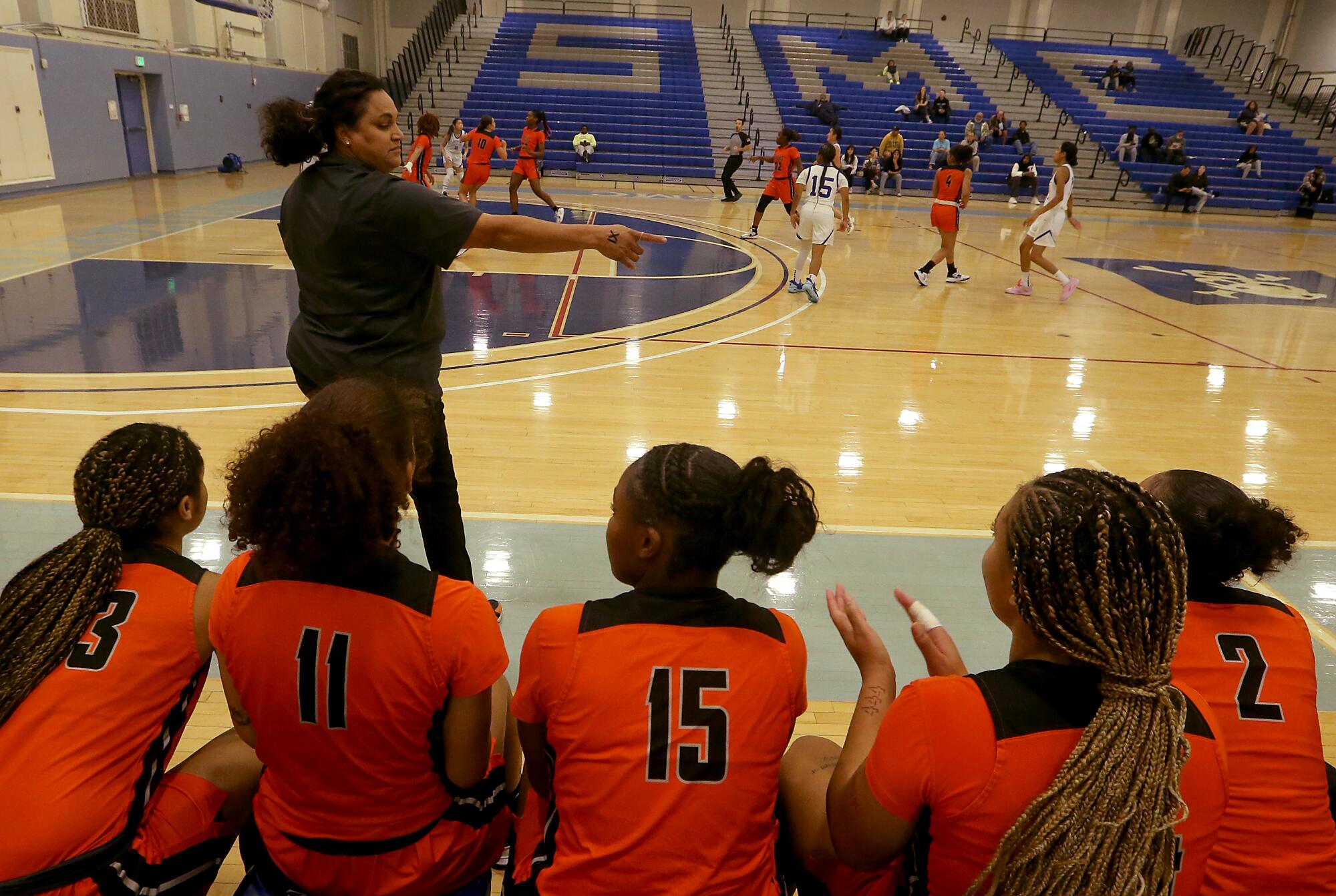 Riverside City College women's basketball coach Alicia Berber directs her players during a game.