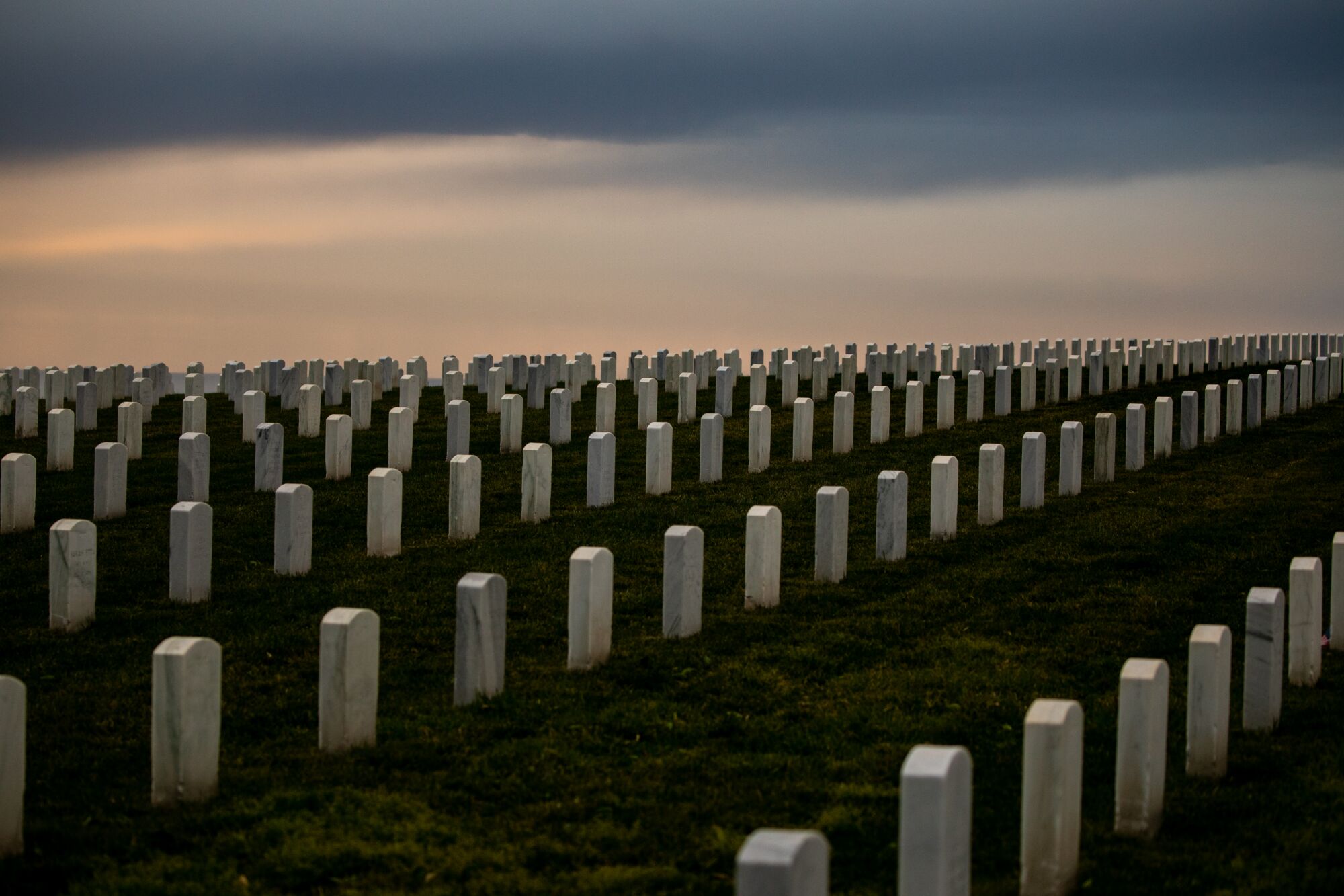 At Fort Rosecrans National Cemetery, the air is thick with the nation’s past struggles.