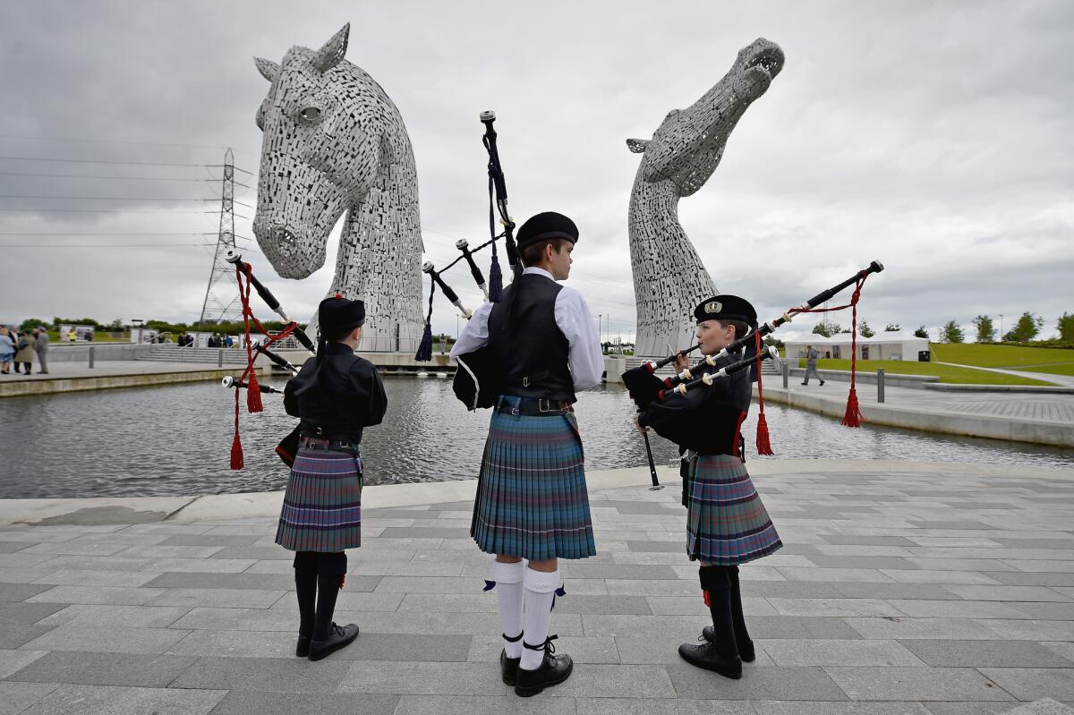 FALKIRK, SCOTLAND - JULY 08: The Kelpies sculptures are officially opened by Princess Anne, Princess Royal and a flotilla of boats on July 8, 2015 in Falkirk, Scotland. Sculptor Andy Scott also attended the opening, along with Duke, a Clydesdale horse which was one of the models for the 30m works, which have received more than one million visitors since they were completed in April 2014. (Photo by Jeff J Mitchell/Getty Images) ** OUTS - ELSENT, FPG - OUTS * NM, PH, VA if sourced by CT, LA or MoD **