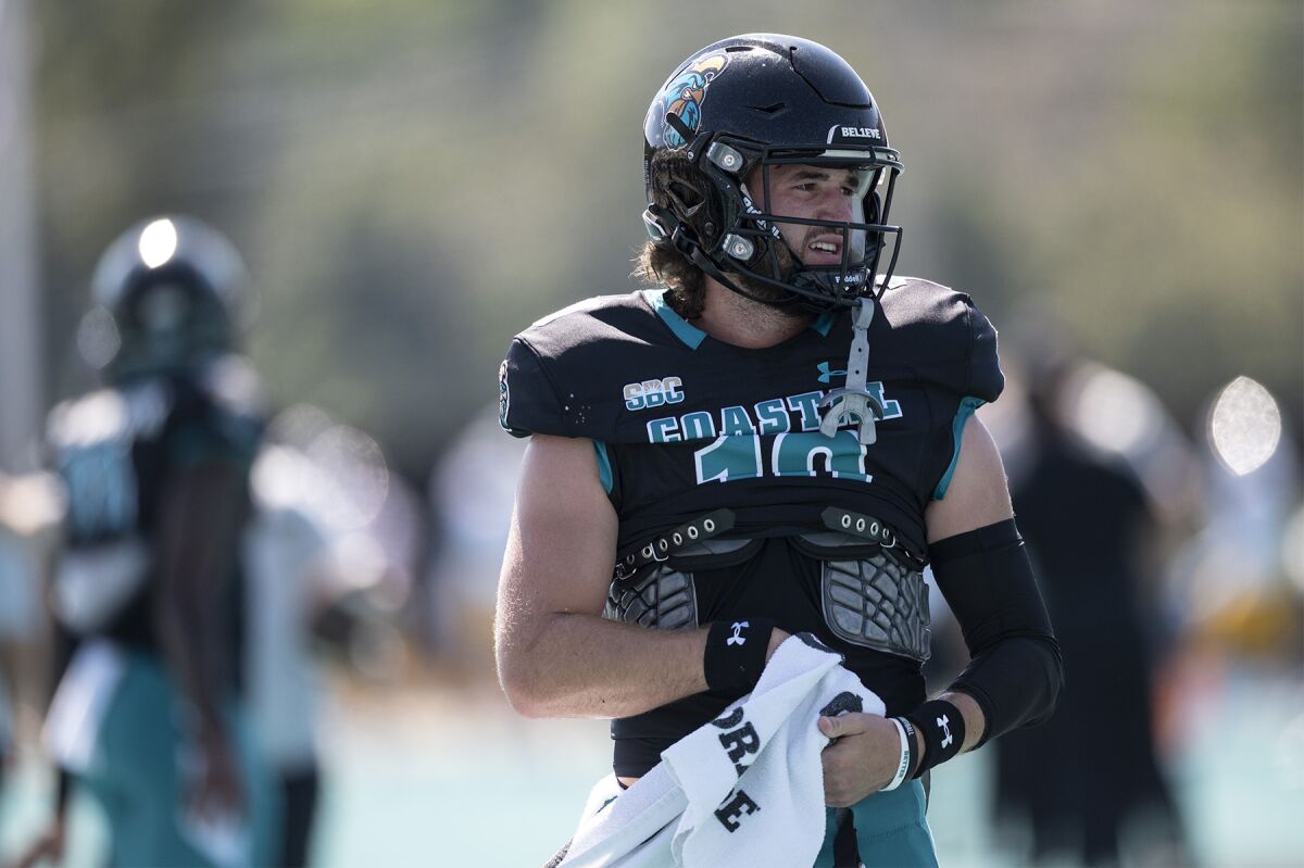Coastal Carolina's Grayson McCall warms up before to an NCAA college football game against Louisiana Monroe on Saturday, Oct. 2, 2021, in Conway, S.C. (AP Photo/Matt Kelley)