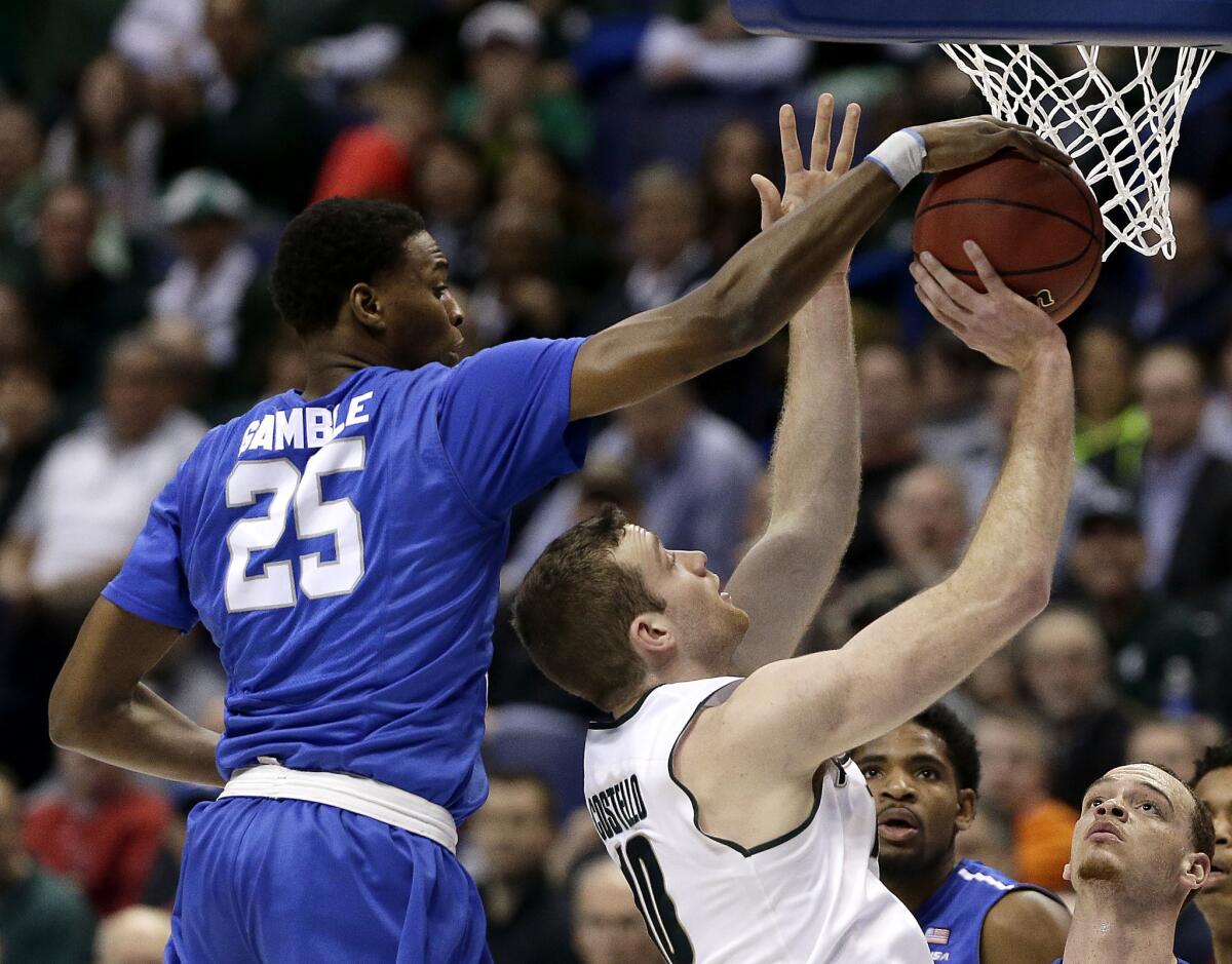 Middle Tennessee's Karl Gamble blocks a shot by Michigan State's Matt Costello.