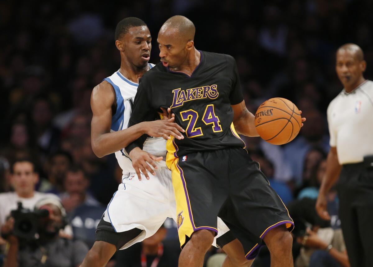 Timberwolves rookie forward Andrew Wiggins defends against Lakers guard Kobe Bryant during a game at Staples Center on Nov. 28, 2014.
