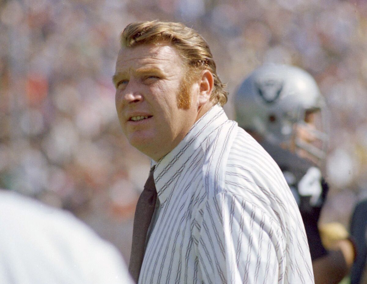 Raiders coach John Madden is pictured on the sidelines.