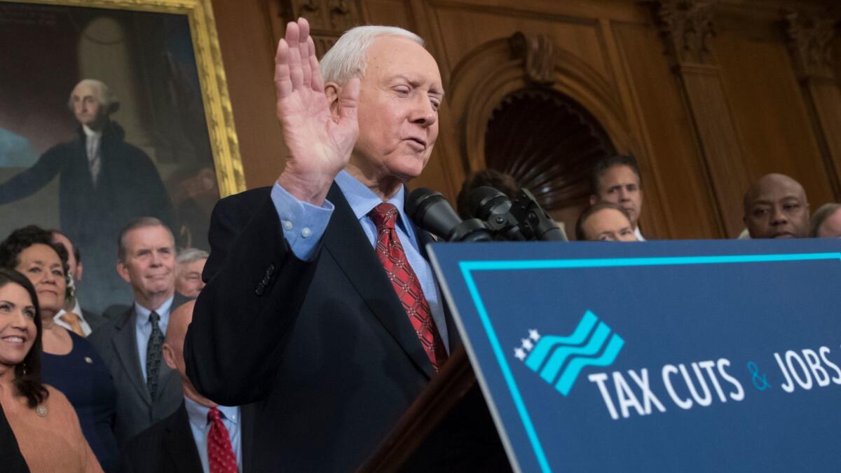 Sen. Orrin Hatch (R-Utah), chairman of the Senate Finance Committee, introduces the final version of the GOP tax bill, which he claimed implausibly didn't involve a tax cut for the rich.