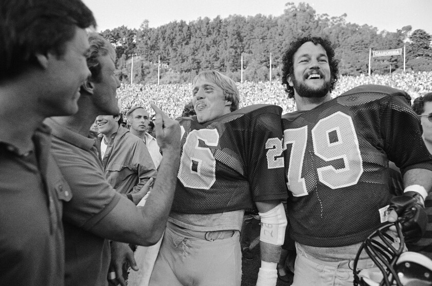 Cal’s Kevin Moen and Ricardo Stelzmiller are all smiles after Cal defeated Stanford, 25-20 on Nov. 20, 1982 in Berkeley.