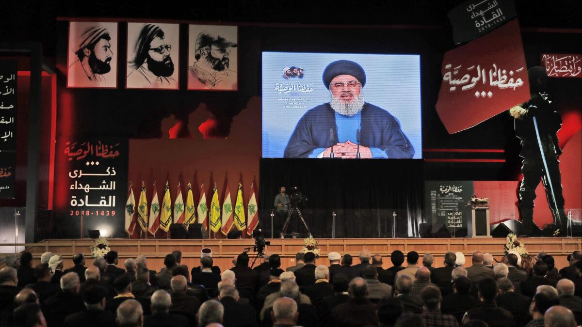 Hezbollah leader Hassan Nasrallah delivers a televised speech during a ceremony held by the Shiite party in Beirut commemorating the party's killed leaders on Feb. 16, 2018..