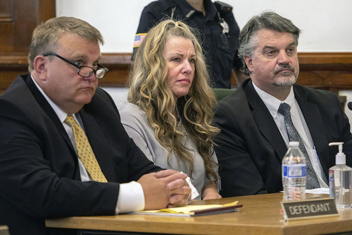FILE - Lori Vallow Daybell, center, sits between her attorneys for a hearing at the Fremont County Courthouse in St. Anthony, Idaho, on Aug. 16, 2022. An Idaho judge has banned cameras from the courtroom in the high-profile triple murder case against a mom and her new husband, saying he fears the images could prevent a fair trial. Lori Vallow Daybell and her new husband Chad Daybell are accused of conspiring together to kill her two children and his late wife. (Tony Blakeslee/East Idaho News via AP, Pool, File)