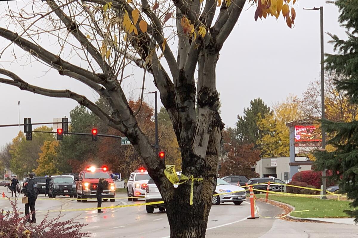 Police close off a street outside a shopping mall 