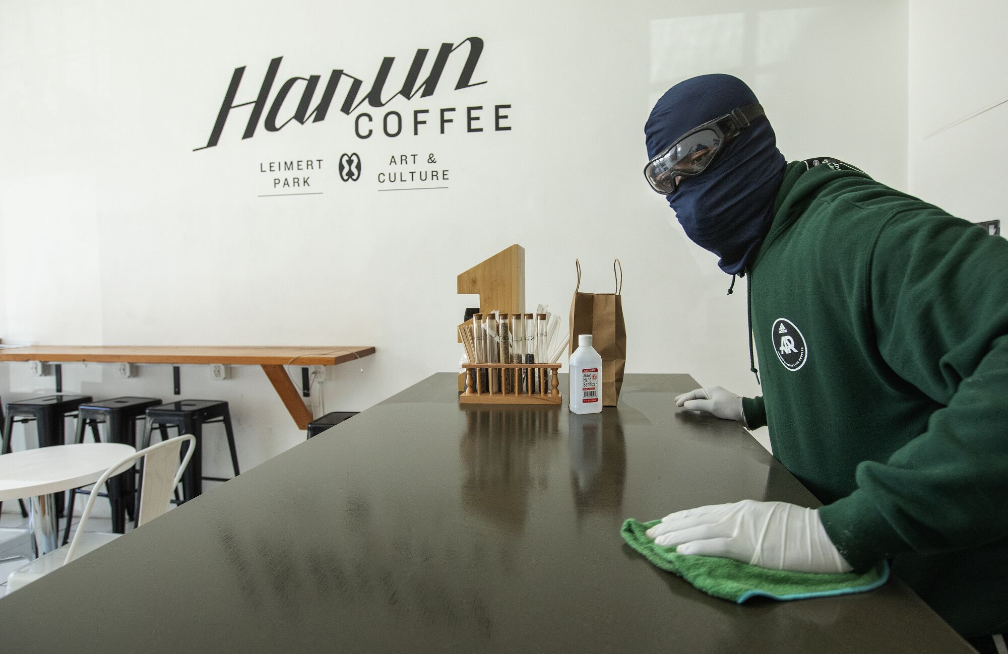 Server wears protective gear at Harun Coffee in South Los Angeles