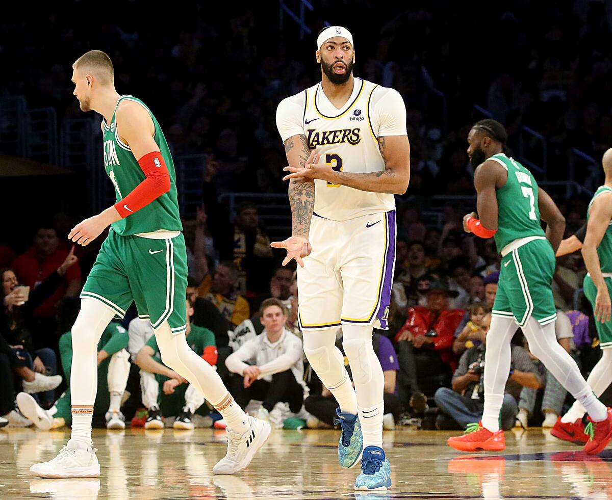 Lakers forward Anthony Davis flashes the signature "freeze" sign after making a three-pointer against the Celtics.