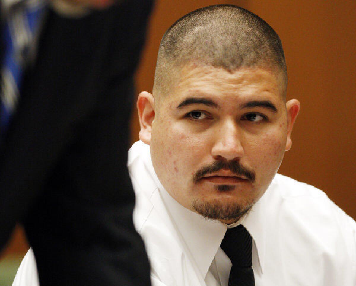 Guillermo Alarcon Jr., right, looks at his attorney, Deputy Public Defender Victor Acevedo, after a judge declared him factually innocent of drug charges in 2008.