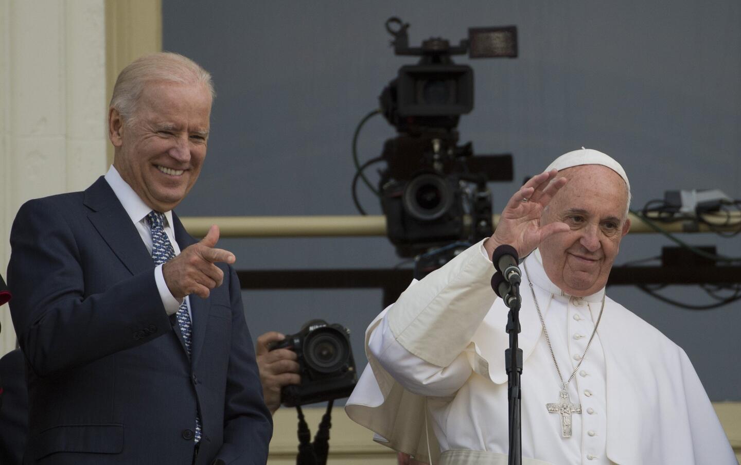 Pope Francis, accompanied by Vice President Joe Biden, waves to the crowd outside the Capitol Building after addressing Congress in Washington, on Sept. 24, 2015.