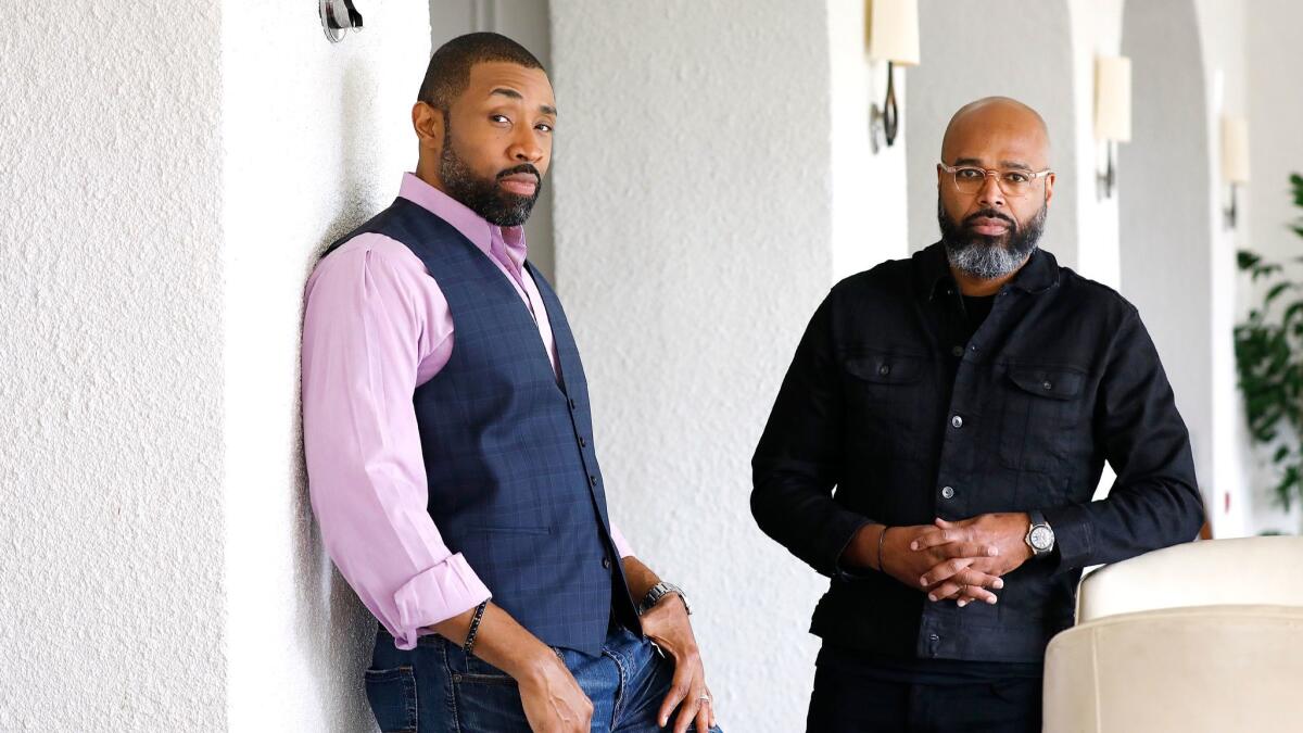 Actor Cress Williams, left, and executive producer Salim Akil of the CW's "Black Lightning," the adaptation of the DC comic book about an African American superhero who can manipulate electricity.