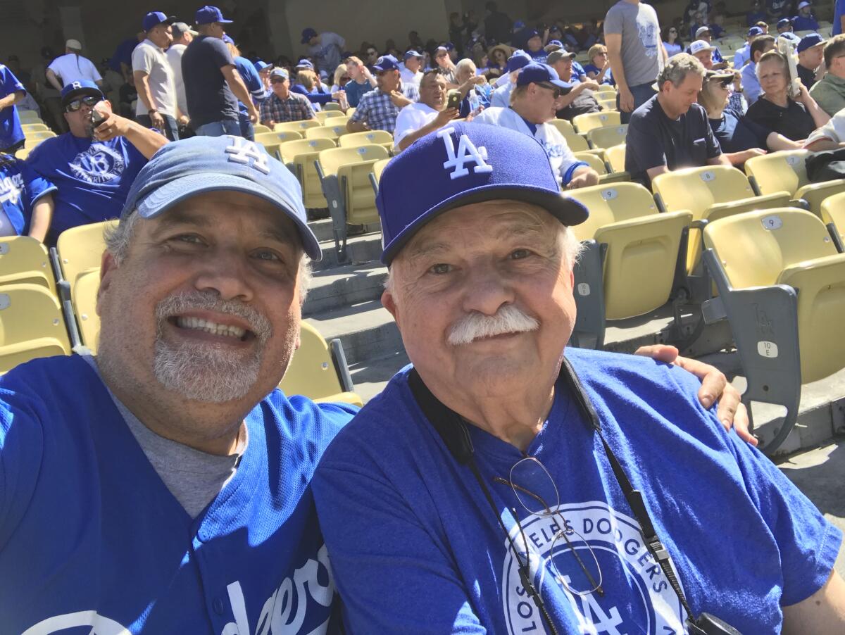 Stan Brooks, left, attends opening day at Dodger Stadium in 2018 with his father, Philip.