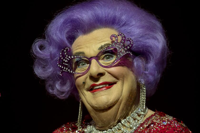 FILE - Australian TV presenter Barry Humphries performs on stage as Dame Edna for the Farewell Tour, at the London Palladium theatre, in central London, on Nov. 13, 2013. Tony Award-winning comedian Barry Humphries, internationally renowned for his garish stage persona Dame Edna Everage, a condescending and imperfectly-veiled snob whose evolving character has delighted audiences over seven decades, died on Saturday, April 22, 2023, after spending several days in a Sydney hospital with complications following hip surgery, a Sydney hospital said. He was 89 years old. (Photo by Joel Ryan/Invision/AP, File)