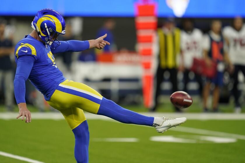 Los Angeles Rams punter Riley Dixon punts during the first half of a preseason NFL football game against the Houston Texans Friday, Aug. 19, 2022, in Inglewood, Calif. (AP Photo/Ashley Landis)