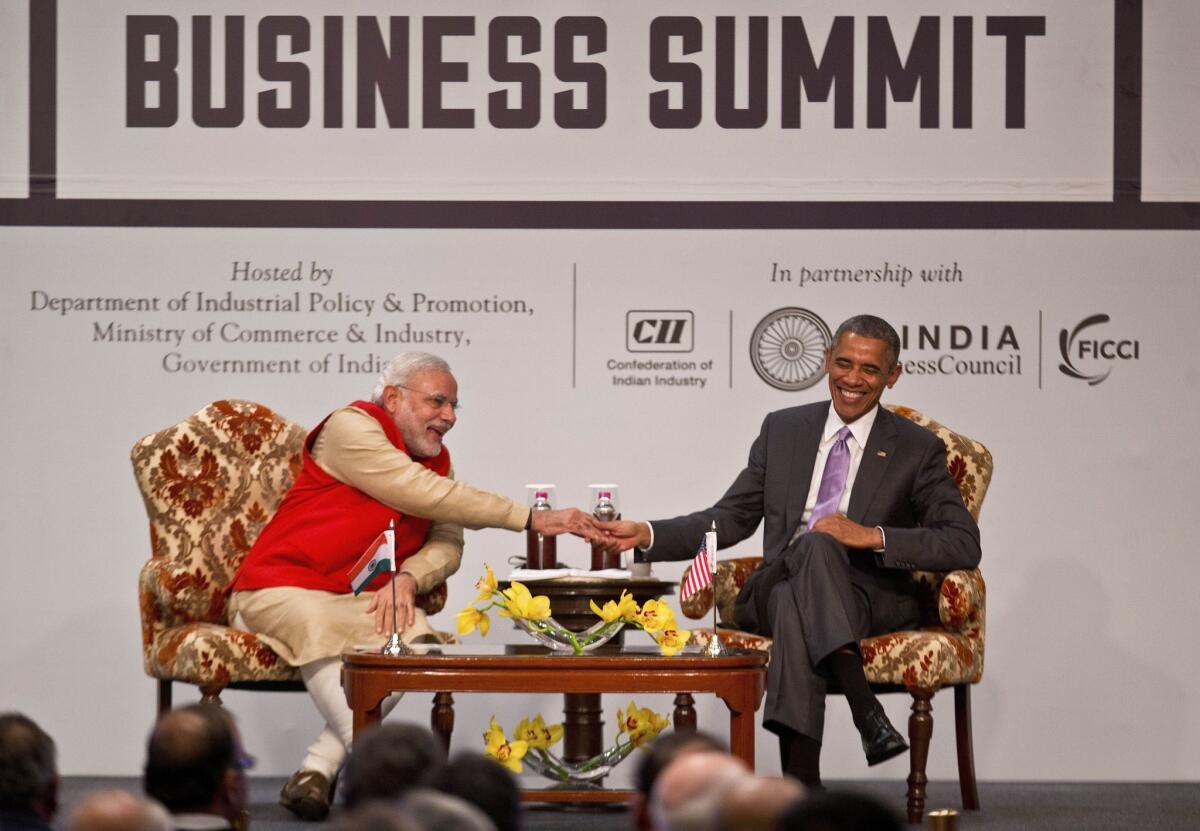 President Obama appears with Indian Prime Minister Narendra Modi at the India-U.S business summit in New Delhi on Jan. 25.