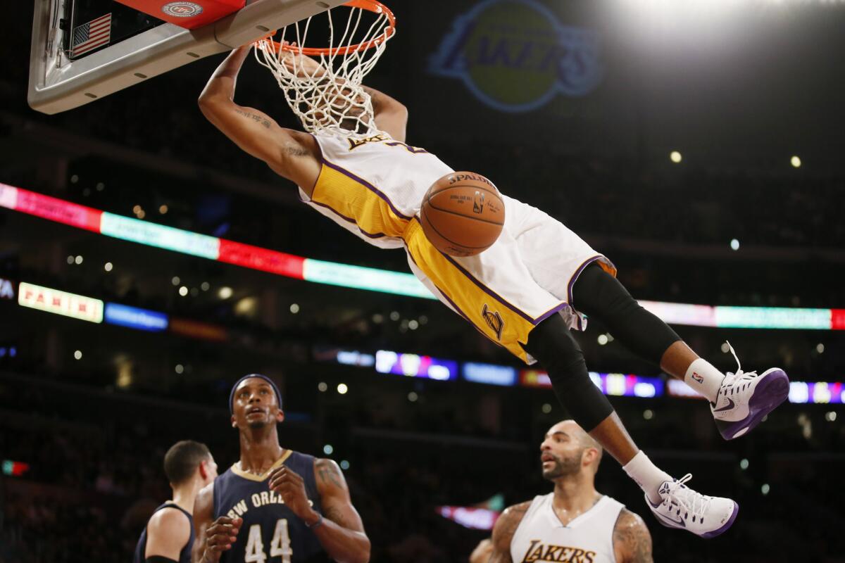 Lakers guard Wayne Ellington throws down a dunk against the Pelicans in the second half.