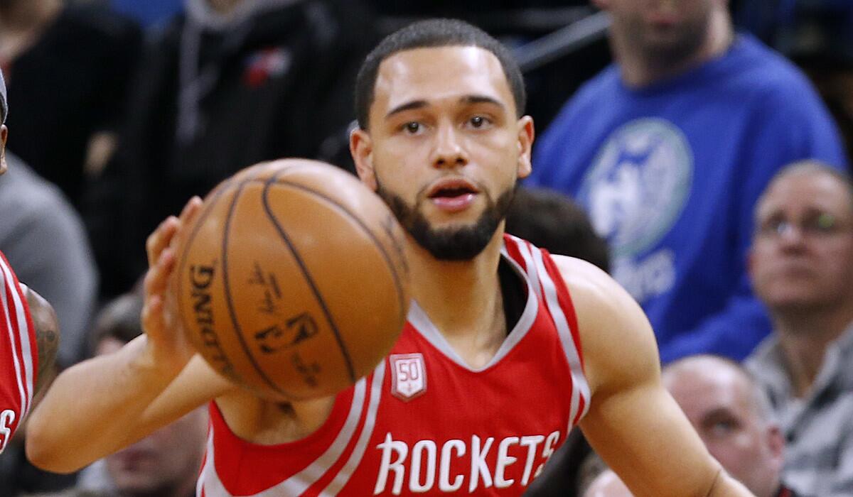 Former Rockets guard Tyler Ennis dribbles the ball during a game against the Timberwolves on Jan. 11.