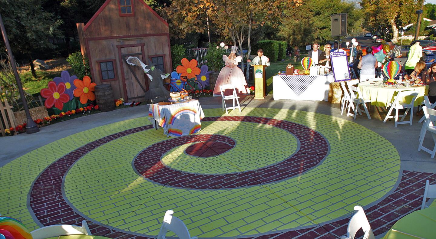 A yellow brick road, painted on the sidewalk by city staff, at Olberz Park in La Cañada Flintridge at the annual La Cañada Flintridge Chamber of Commerce mixer on Thursday, September 17, 2015.