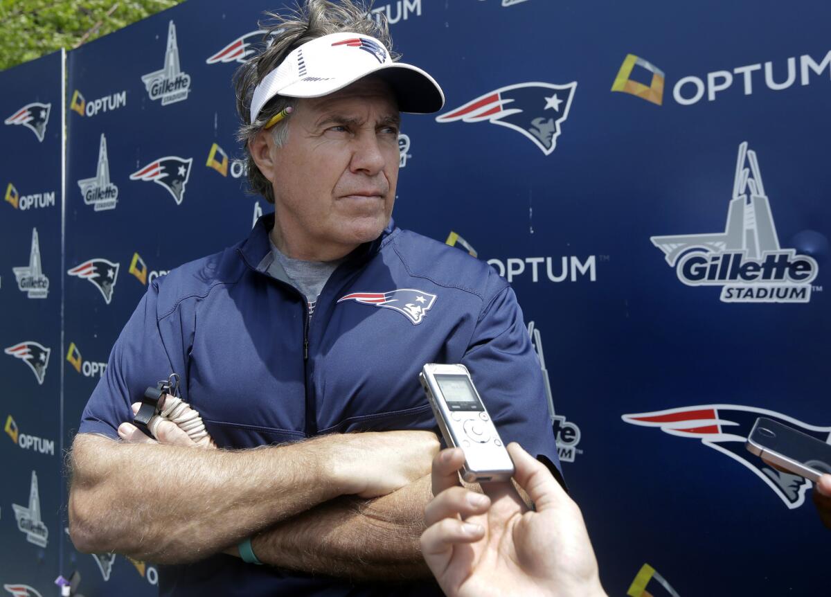 New England Coach Bill Belichick speaks to reporters after an organized team activity on June 11.