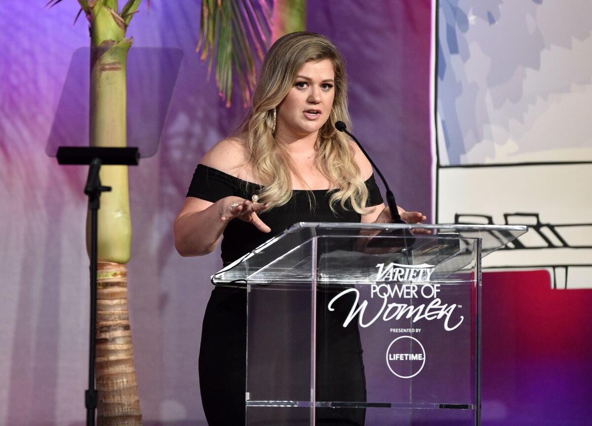 Honoree Kelly Clarkson tells a story about the power of "Wonder Woman" during Variety's Power of Women luncheon in Beverly Hills.