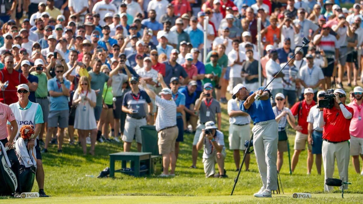 Tiger Woods plays from the s17th tee during the third round of the PGA Championship on Aug. 11 at Bellerive Country Club.