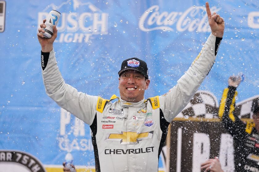 Kyle Busch celebrates after winning a NASCAR Cup Series auto race at Auto Club Speedway in Fontana.