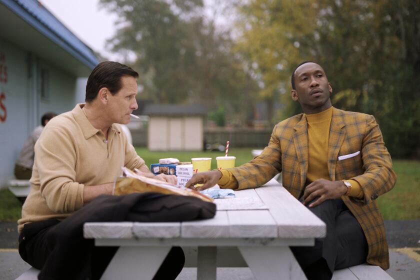 This image released by Universal Pictures shows Viggo Mortensen, left, and Mahershala Ali in a scene from "Green Book." The film is nominated for an Oscar for best picture. The 91st Academy Awards will be held on Sunday. (Universal Pictures via AP)