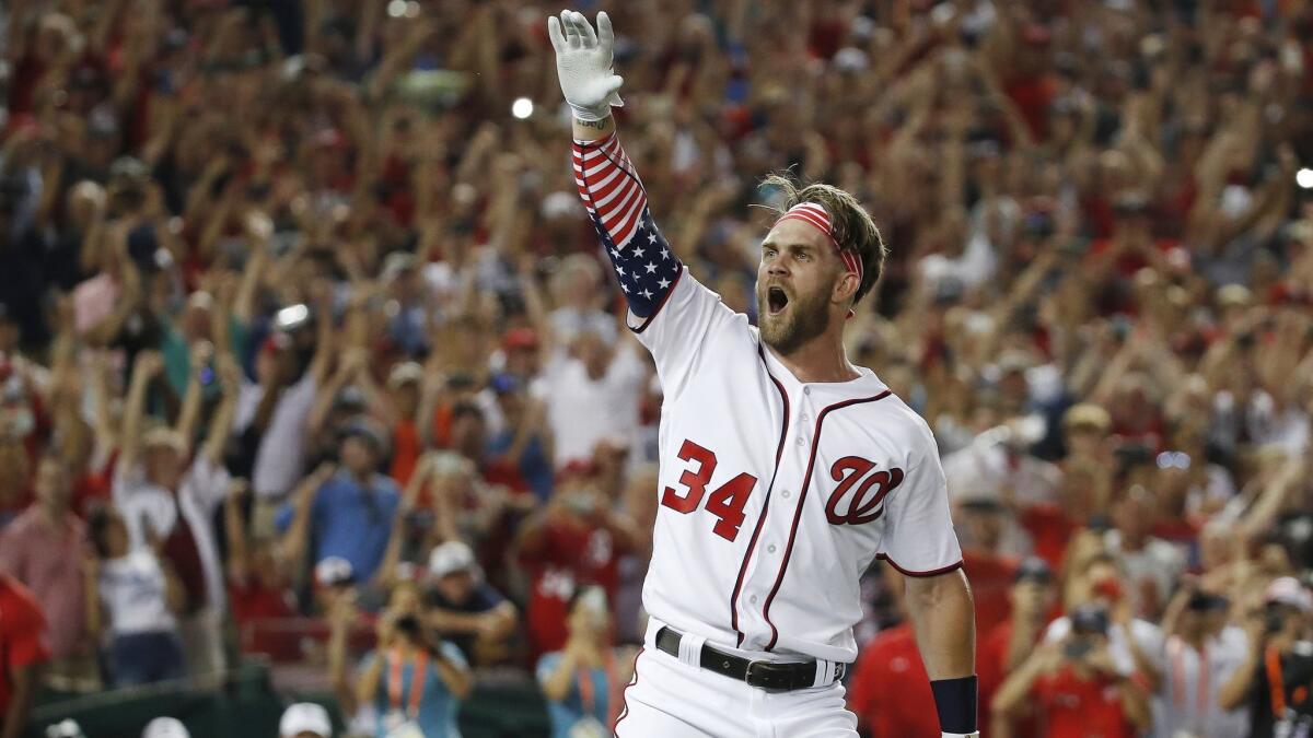 Bryce Harper celebrates winning the 2018 Home Run Derby. A $1-million prize for the winner of the event is one of several MLB changes.