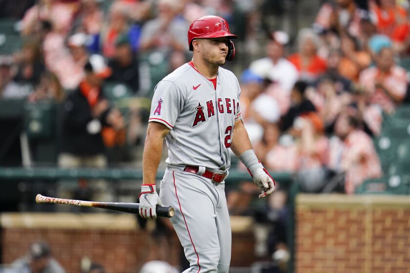 Los Angeles Angels' Mike Trout heads to the dugout after striking out against the Baltimore Orioles during the eighth inning of a baseball game, Saturday, July 9, 2022, in Baltimore. The Orioles won 1-0. (AP Photo/Julio Cortez)