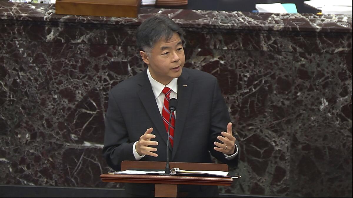 Ted Lieu speaks at a podium.