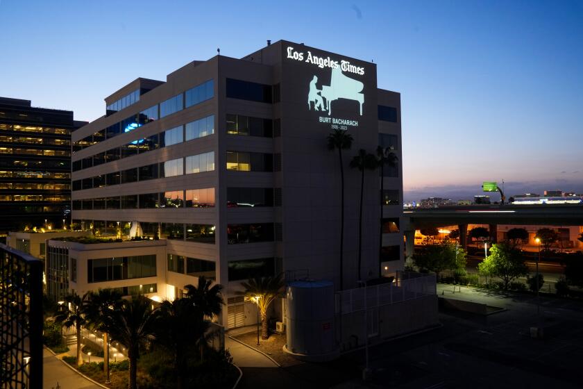 El Segundo, CA - March 10: A memorial of Burt Bacharach is projected on the side of the Los Angeles Times building on Friday, March 10, 2023 in El Segundo, CA. (Andrew Gombert / Los Angeles Times)