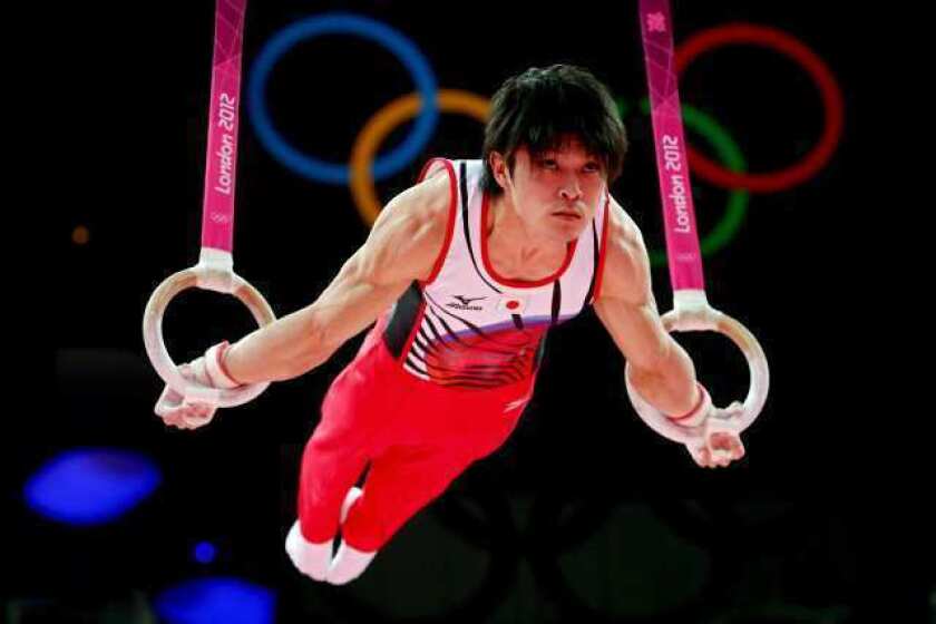All-around leader Kohei Uchimura of Japan competes on the rings Wednesday.
