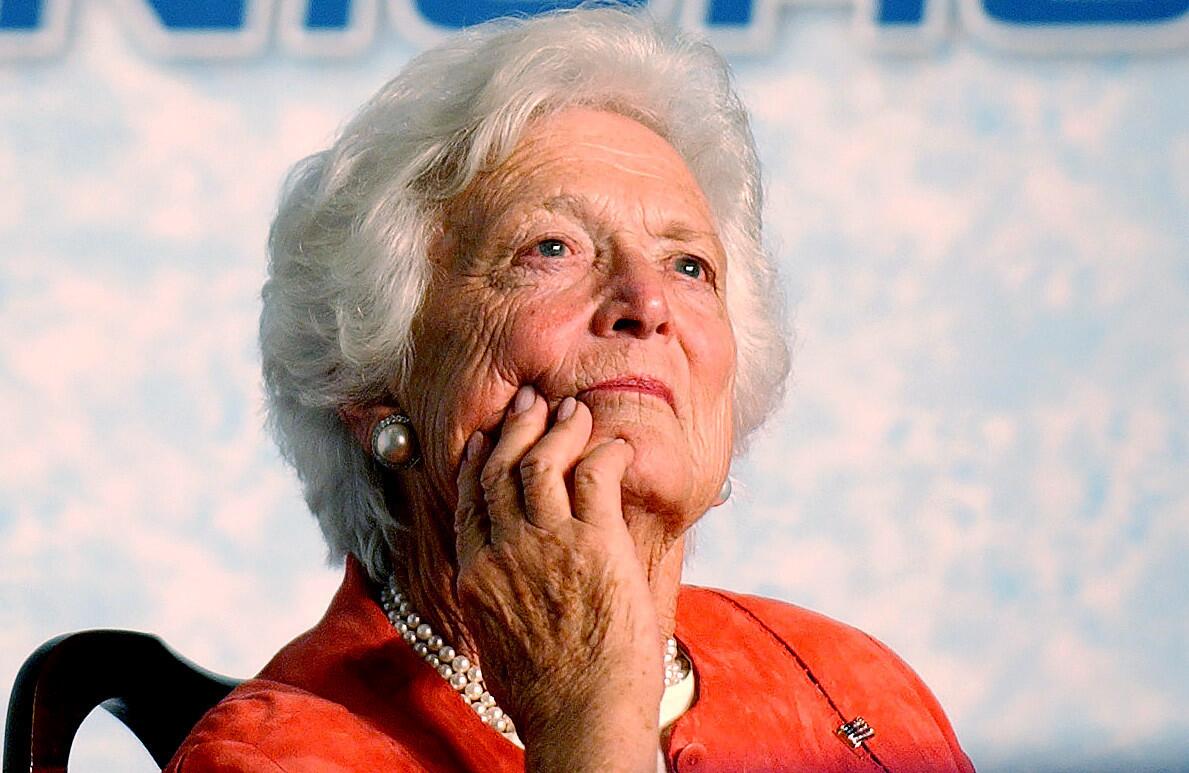 2005 FILE PHOTO: Former first lady Barbara Bush listens to her son President George Bush speak during a stop at the Lake Nona YMCA Family Center in south Orlando for Bush's speech on his Social Security plan, Friday, March 18, 2005, (Joe Burbank/Orlando Sentinel ) trax 00052747A