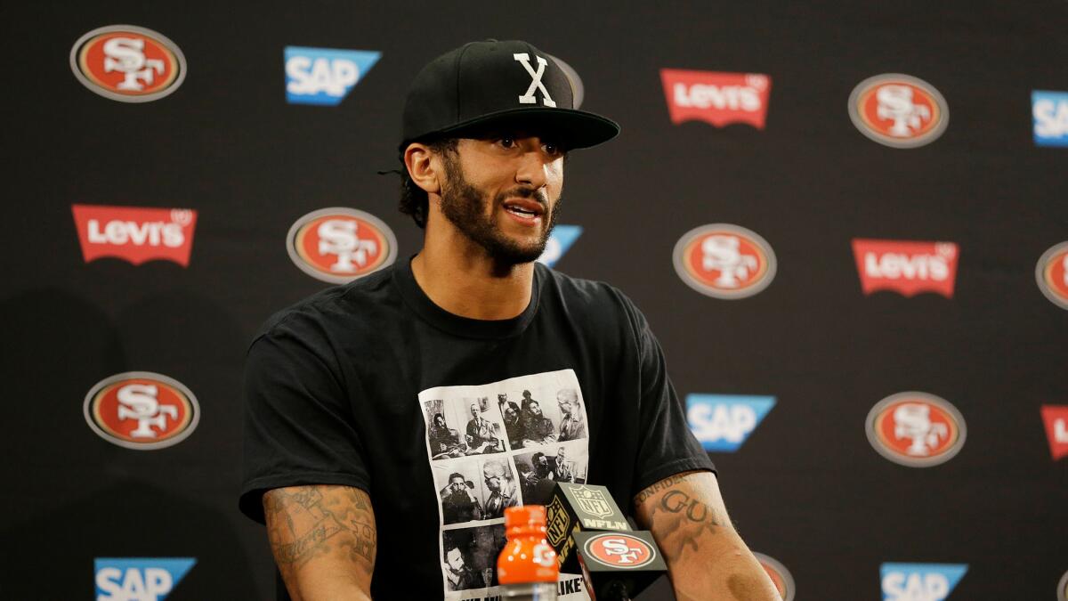 Colin Kaepernick addresses reporters after a preseason game against the Green Bay Packers on Aug. 26.