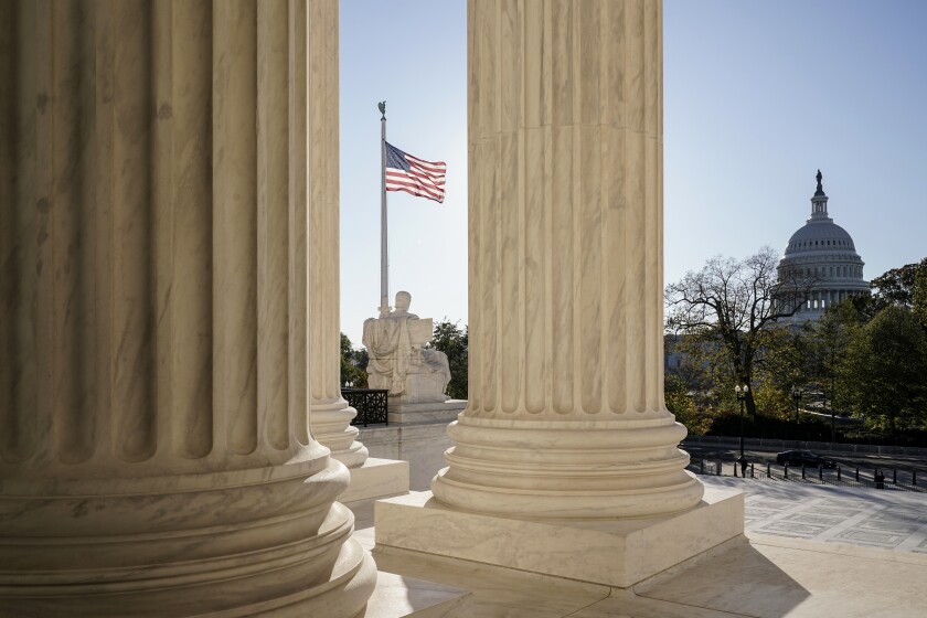 The Supreme Court is seen in Washington, with the Capitol in the distance.