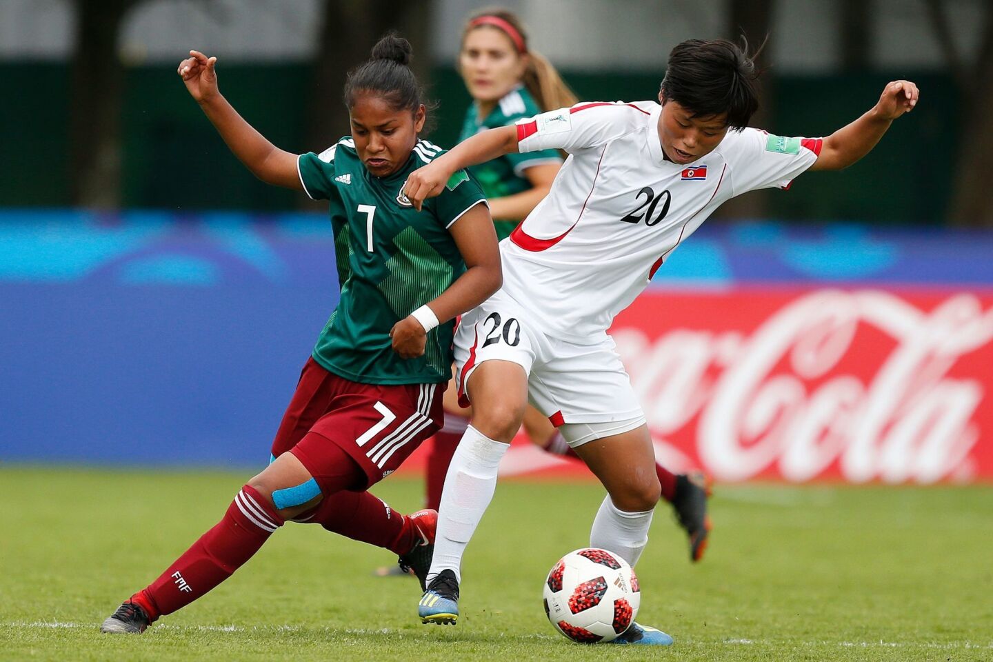 Mexico's Belen Cruz vies for the ball with Korea's Kum Ok Choe during the Women's World Cup U20 Group B football match between North Korea and Mexico at the Clos Gastel stadium in Dinan, northwestern France, on August 8, 2018. (Photo by CHARLY TRIBALLEAU / AFP)CHARLY TRIBALLEAU/AFP/Getty Images ** OUTS - ELSENT, FPG, CM - OUTS * NM, PH, VA if sourced by CT, LA or MoD **