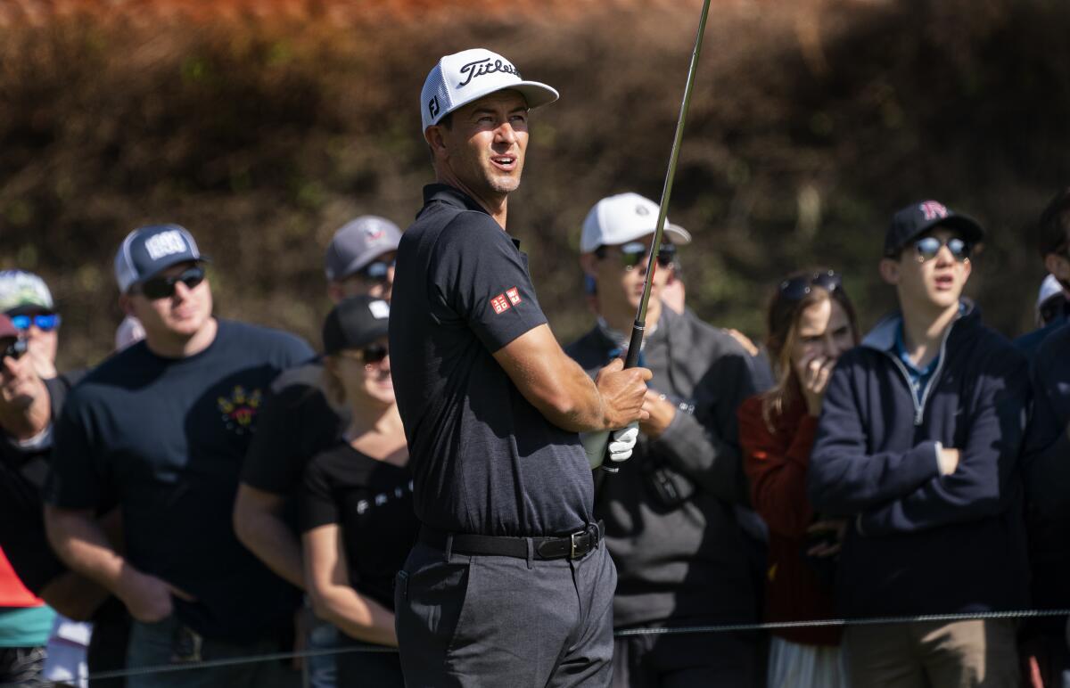 Co-leader Adam Scott watches his shot from the 14th tee during the third round of the Genesis Invitational at Riviera Country Club in Pacific Palisades on Saturday.