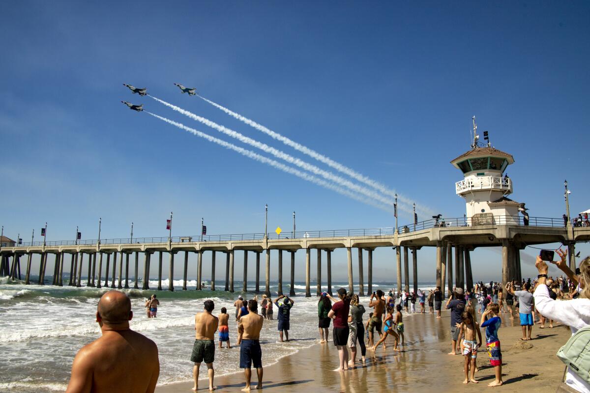 The U.S. Air Force Thunderbirds do a fly past over Huntington Beach Pier during last year's Pacific Airshow.