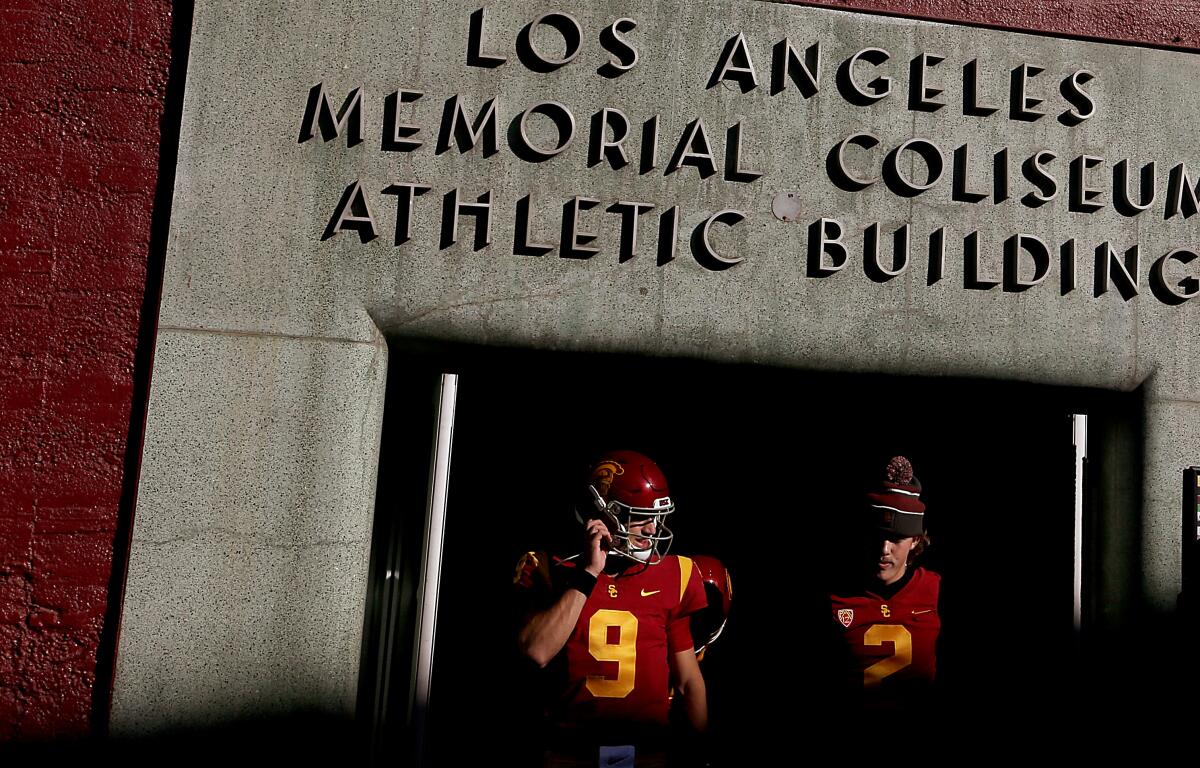 USC quarterbacks Kedon Slovis and Jaxson Dart emerge from the locker room.