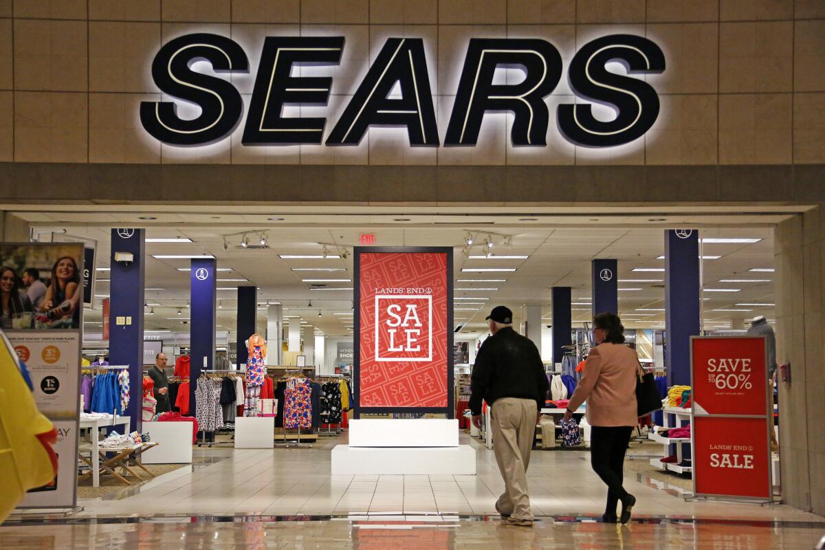 Shoppers walk into a Sears store in Pittsburgh in February.