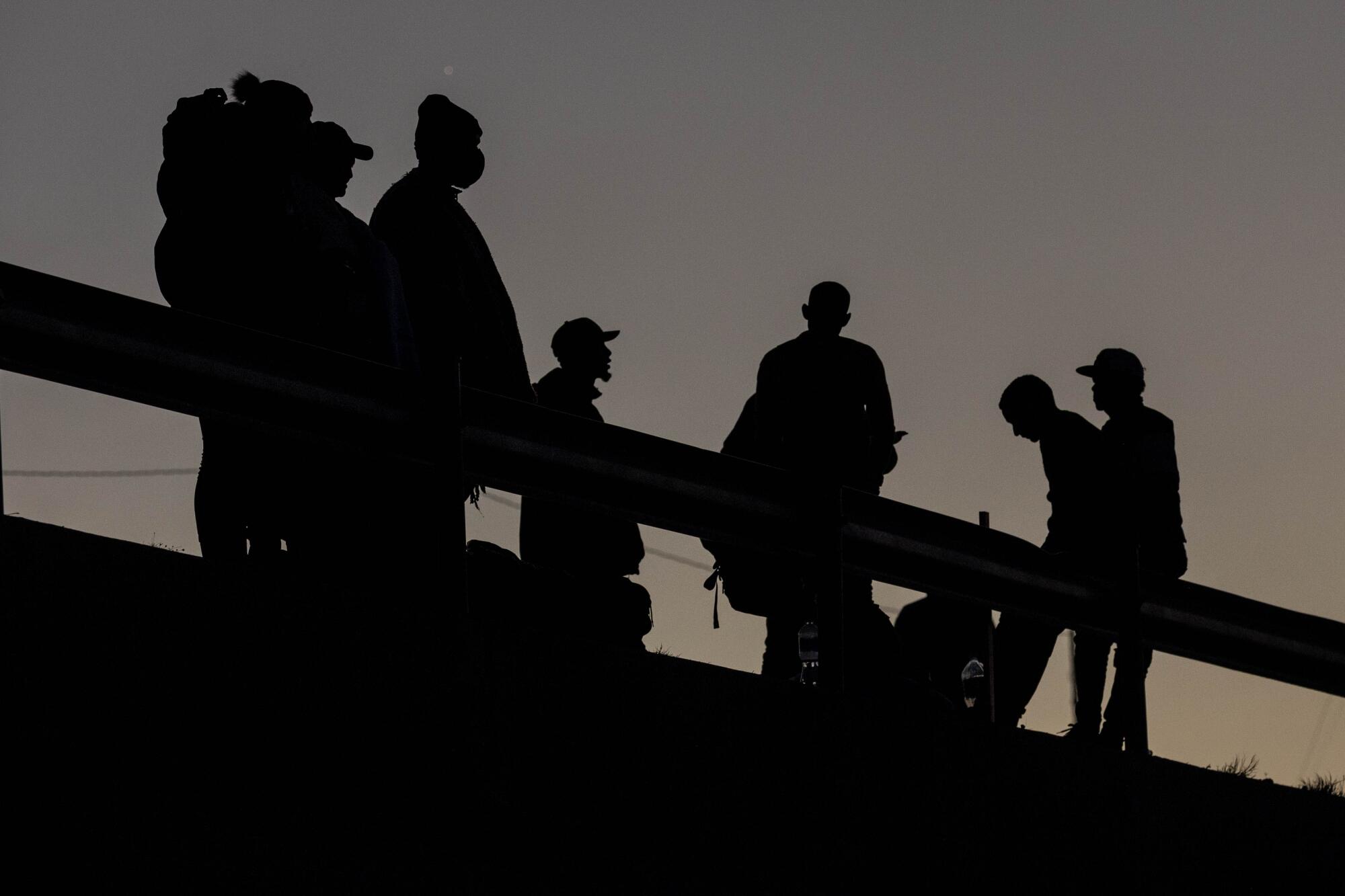 Silhouette of about 10 people